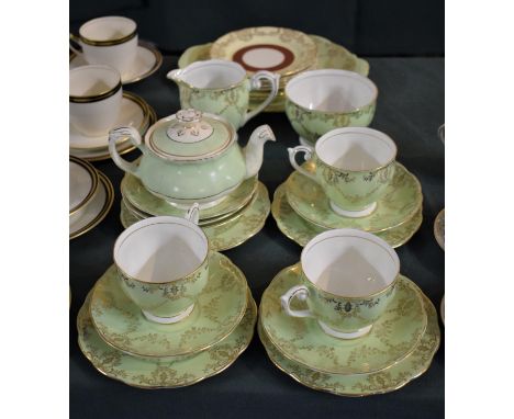 A Part Queen Anne Green &amp; Gilt Tea Set Comprising Three Cups, Sugar, Milk, Six Side Plates, Six Saucers &amp; a Cake Plat