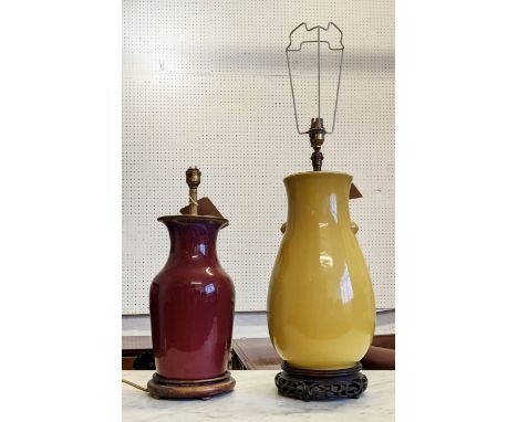 TABLE LAMP, yellow 43cm H on carved Chinese base and a sang de boef lamp, 35cm H. 