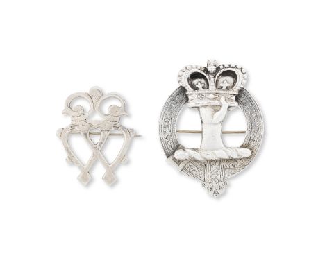 A silver Inverness Luckenbooth brooch and a clan Robertson broochThe first: The engraved twinned heart brooch with safety cha