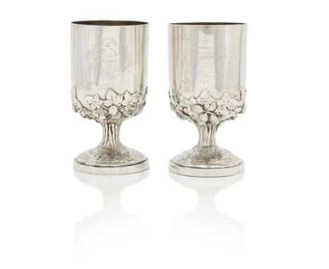 A pair of Victorian regimental presentation gobletsBy Hunt and Roskell, London, 1867 The pedestal bases wrapped with fruiting