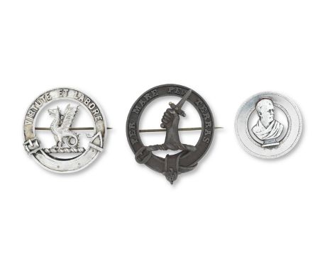 Two clan brooches and a Walter Scott broochThe bronzed metal clan brooch with motto inscribed Per Mare Per Terras, 52mm wide,