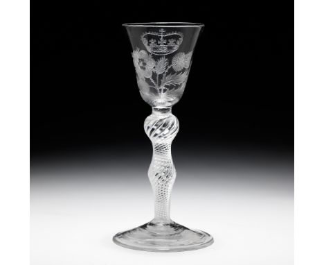 A rare engraved Jacobite airtwist wine glasscirca 1750The round funnel bowl decorated with an heraldic rose and thistle growi