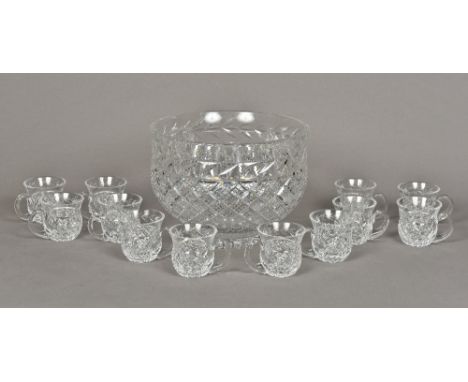 A Waterford cut crystal glass punch setComprising: a large punch bowl and twelve punch glasses; together with Waterford certi