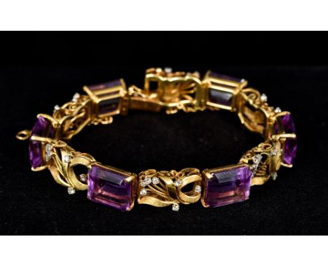 An 18 K gold, diamond and amethyst braceletOf pierced scrolling floral form.  19 cm long.    CONDITION REPORTS:  Generally in
