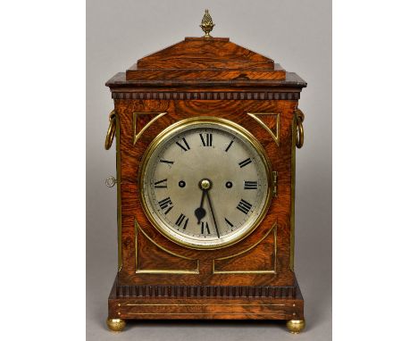 A 19th century brass mounted rosewood bracket clockThe stepped domed top surmounted with a pineapple finial above twin ring h