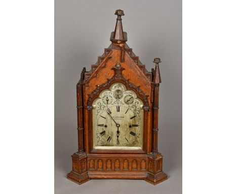 A Victorian oak Gothic architectural cased chiming bracket clockThe silvered dial with Roman numerals inscribed J B Jenkinson