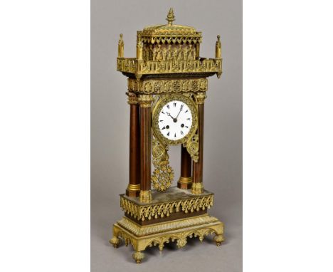 A 19th century Empire style ormolu mounted portico clock, made for the Turkish marketThe white enamelled dial with Eastern Ar