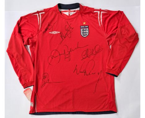 Signed England Long Sleeved Away Shirt 2004 which has been signed to the front by Beckham (7), Wes Brown, Wayne Rooney, Rio F