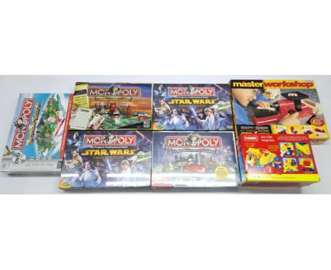 A group of themed Monopoly board games and other collectables. Conditions appear generally Good to Mint (due to most of the M