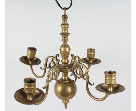 A SMALL 18TH - 19TH CENTURY, POSSIBLY DUTCH, FOUR BRANCH WALL LIGHT. 14ins diameter.