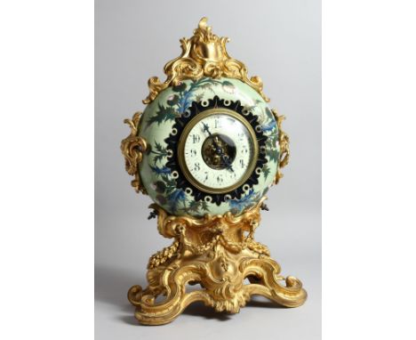 A VERY GOOD UNUSUAL FRENCH PORCELAIN AND ORMOLU MANTLE CLOCK, by L. P. JAPY et. CIE, of circular form, painted with thistles,