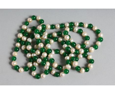 A LONG STRING OF JADE AND PEARL BEADS. 46ins long.