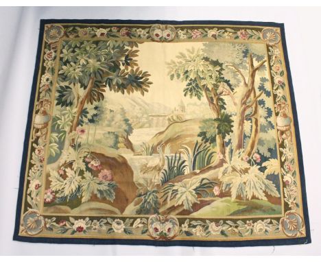 A GOOD BRUSSELS NEEDLEWORK TAPESTRY PICTORIAL WALL HANGING. depicting a river landscape with trees, flowers and exotic birds,