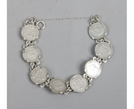 A silver six pence bracelet by P & R Bushell Birmingham, 20.7 grams.