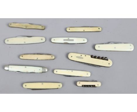 Eleven multi blade and tool folding pocket knives with ivory scales. 