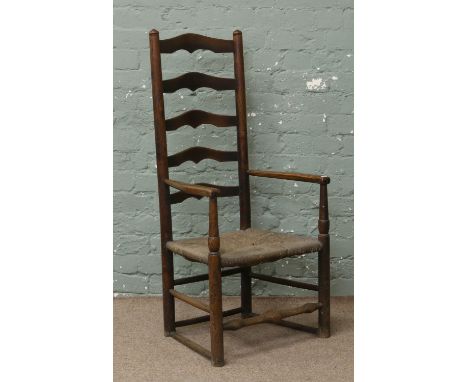 An oak ladder back chair with rush work seat (AF).