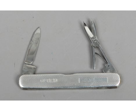 A silver multi tool folding pocket knife by William Neale. With engine turned engraving and assayed Sheffield 1955.