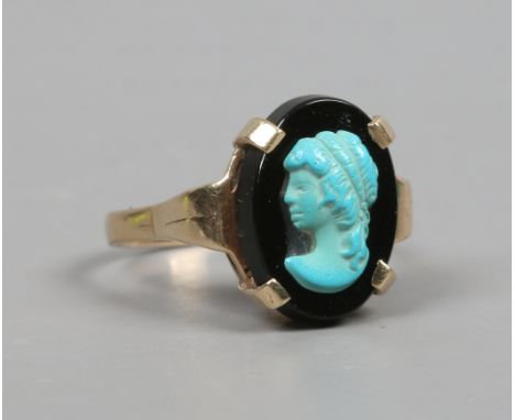 A 9ct gold ring with onyx and turquoise cameo depicting a young maiden. Size K.