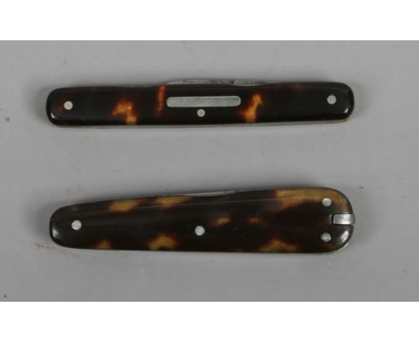 Two multi tool folding pocket knives with tortoiseshell scales. 