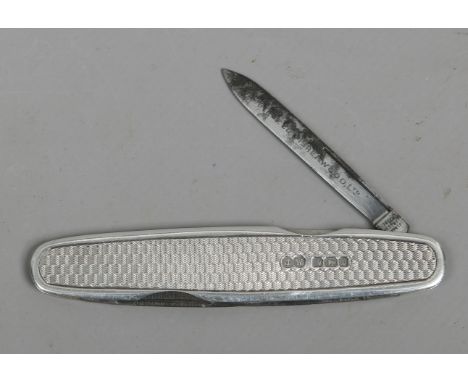 A silver multi blade folding pocket knife by John Watts. With engine turned engraving and assayed Sheffield 1913.
