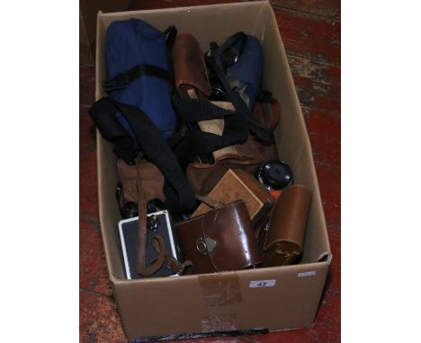 A box of vintage cameras and photographic equipment including Zeiss Ikon, Kodak, Nikon F65, Pentax Me Super etc.