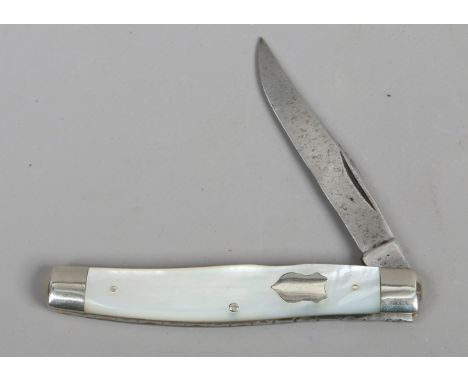 A Rodgers of Sheffield folding knife with worked back and mother of pearl scales. 