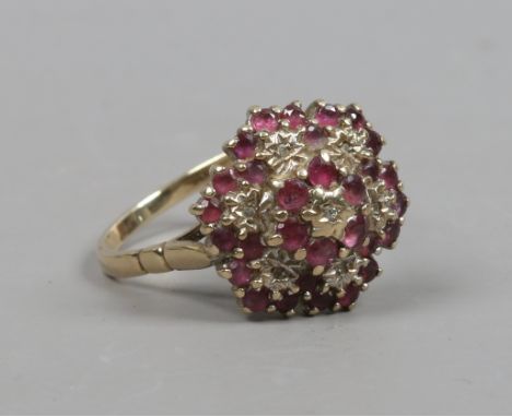 A 9ct gold cluster ring set with rubies and diamonds size R 1/2