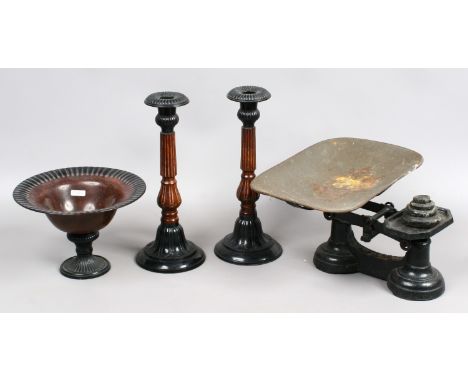 A set of cast iron kitchen scales and weights and a bronzed metal garniture.