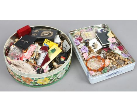 Two tins of mixed vintage costume jewellery including marcasite and paste set examples.