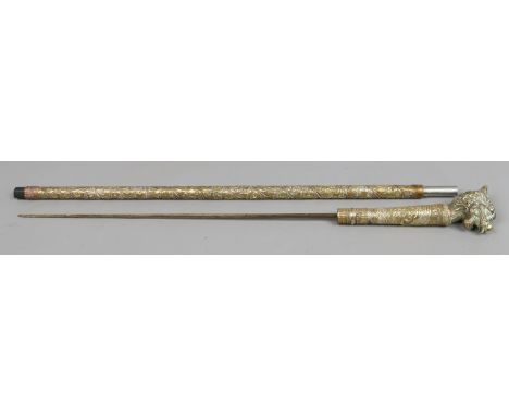 A brass fluted blade sword stick decorated in the Chinese style with dog of fo handle.   Condition Report. To be used as a gu