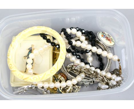 A box of costume jewellery including French jet necklace, paste spray brooch and opal brooch.