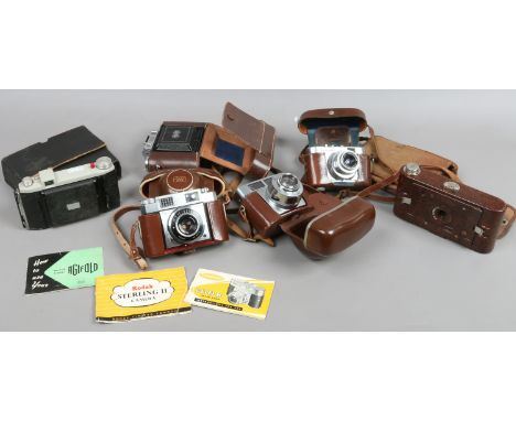 A group of cased vintage cameras including a Kodak No.2 Hawkette bakelite camera, Agifold, Voighander, Zeiss Ikon Contina etc