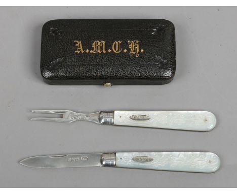 A cased Victorian silver folding fruit knife and fork set by Thomas Marples with mother of pearl scales. Assayed London 1883.