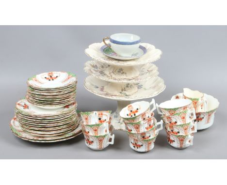 An Edwardian china tea service decorated with arches and flowers by J.H.C & Co. along with three floral pattern cakestands an