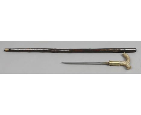 A rootwood brass handled short blade sword stick   Condition Report. To be used as a guide only.  Good condition