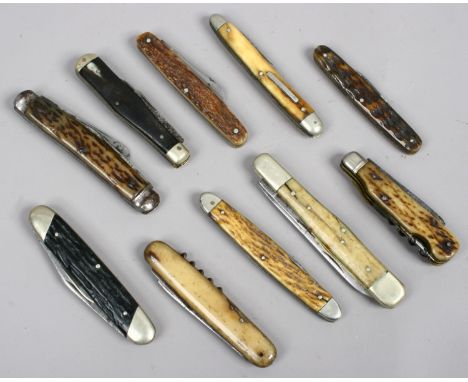 Ten multi blade and tool folding pocket knives with stag antler scales. 