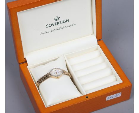 A ladies Sovereign 9ct gold bracelet watch in fitted box. With diamond bezel and oval mother of pearl dial having applied Rom