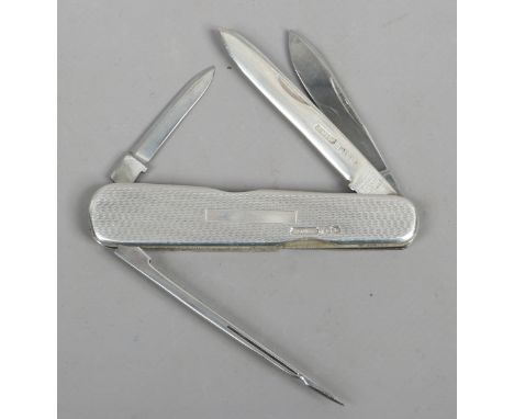 A John Watts silver multi tool fruit knife with engine turned engraving. Assayed Sheffield 1942.
