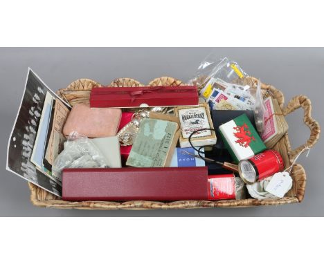 A basket containing old playing cards, tins, jewellery boxes, costume jewellery etc