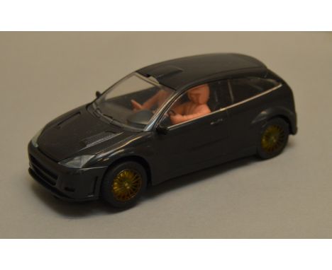 SCALEXTRIC UNRELEASED FORD FOCUS MODEL: Black with black interior and pink driver and passenger, clear wheels and clear scree