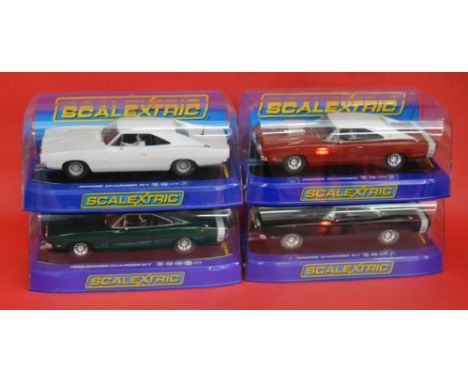 4 SCALEXTRIC DODGE CHARGERS: C3317 Hot Rod, C3218 1969 R/T, C3223 1969 R/T, C3064 1969 R/T Green. All excellent/mint and boxe
