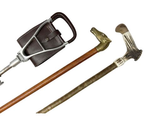 Adjustable shooting stick, together with walking stick with a brass horse head handle and another example with a horn handle,