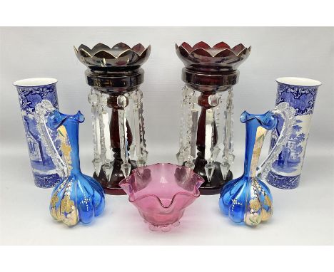 Pair of Victorian ruby glass lustre vases, each with hollow baluster stem, and domed base, hung with prism drops and lozenges