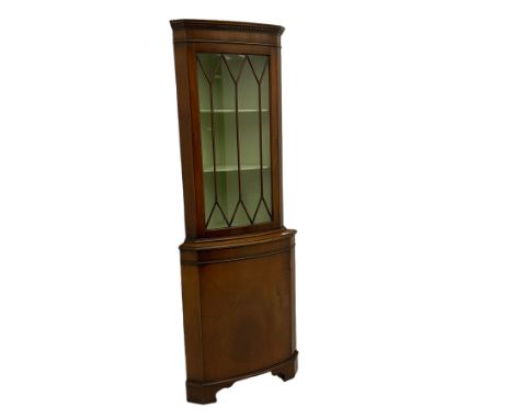 20th century mahogany corner display cabinet,  projecting cornice, dentil frieze, single glazed door enclosing two shelves, a