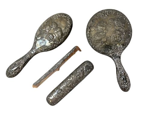 Silver mounted dressing table set by W I Broadway &amp; Co, ornately embossed with cherubs and scrolls etc, comprising silver