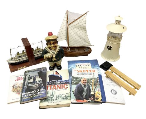 Nautical themed decorative items, to include Titanic book ends, model boat, books, lighthouse lamp etc in one box