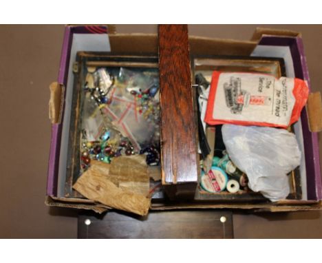 TWO WOODEN TRINKET BOXES CONTAINING BEADS