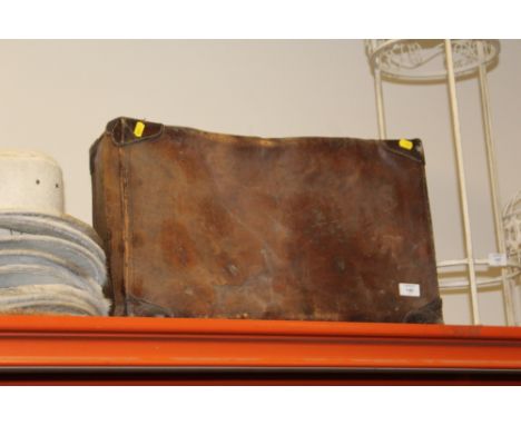 A VINTAGE LEATHER SUITCASE 