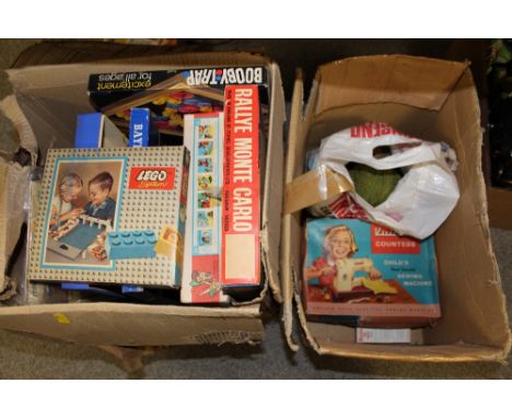 A BOXED VINTAGE VULCAN COUNTESS CHILDS HAND SEWING MACHINE TOGETHER WITH A BOX OF VINTAGE BOARD GAMES ETC.