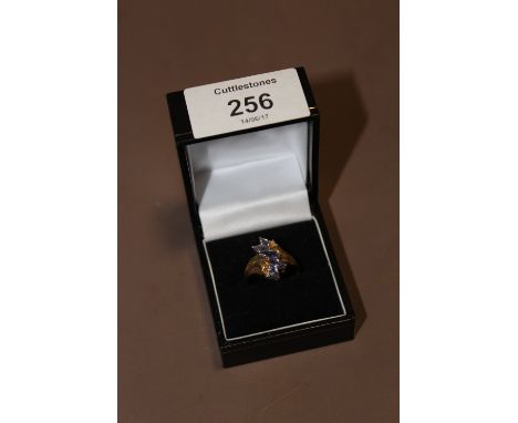 A BOXED 9CT GOLD BLUE STONE AND DIAMOND CLUSTER RING